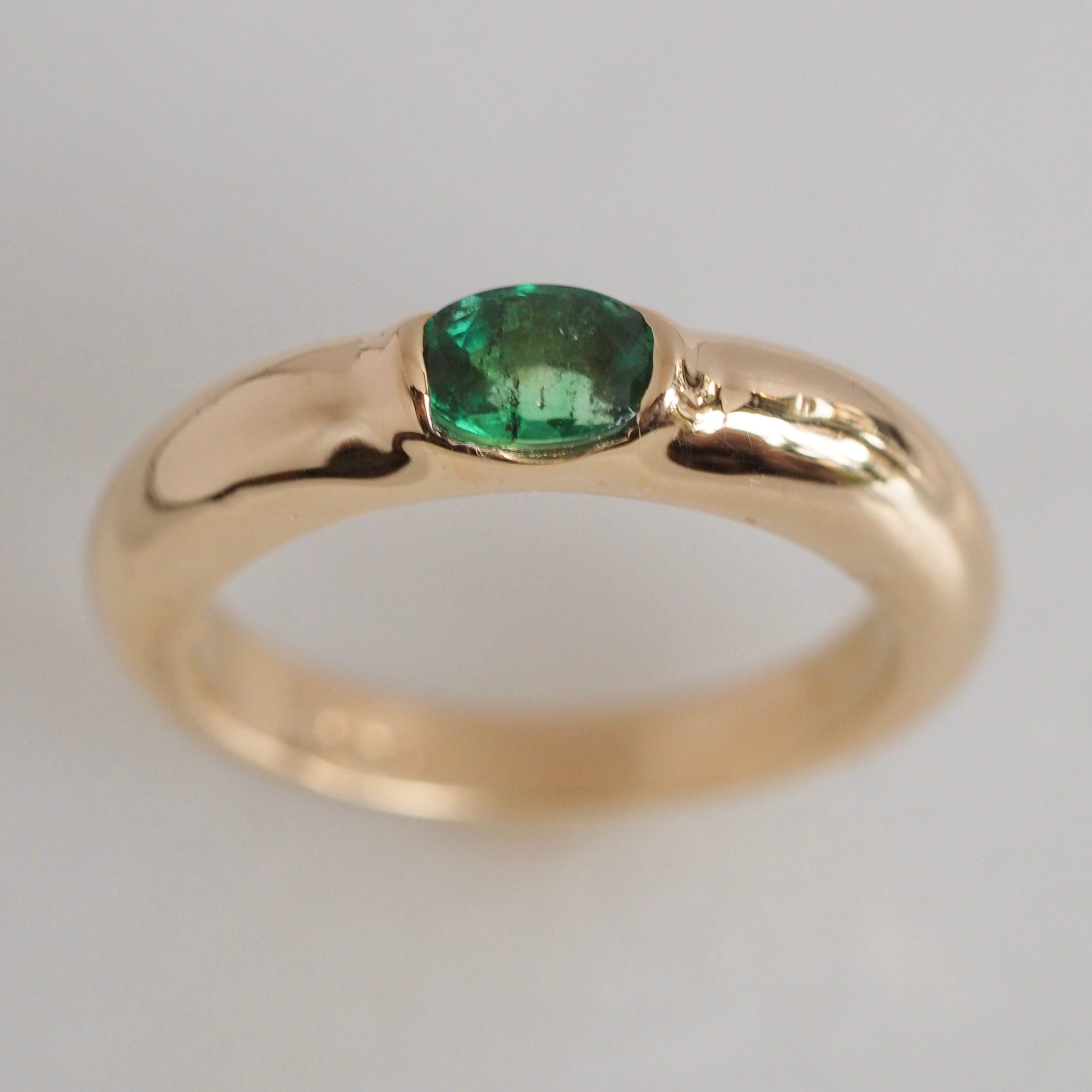 Modernist 14k Gold Emerald Half Bezel Ring