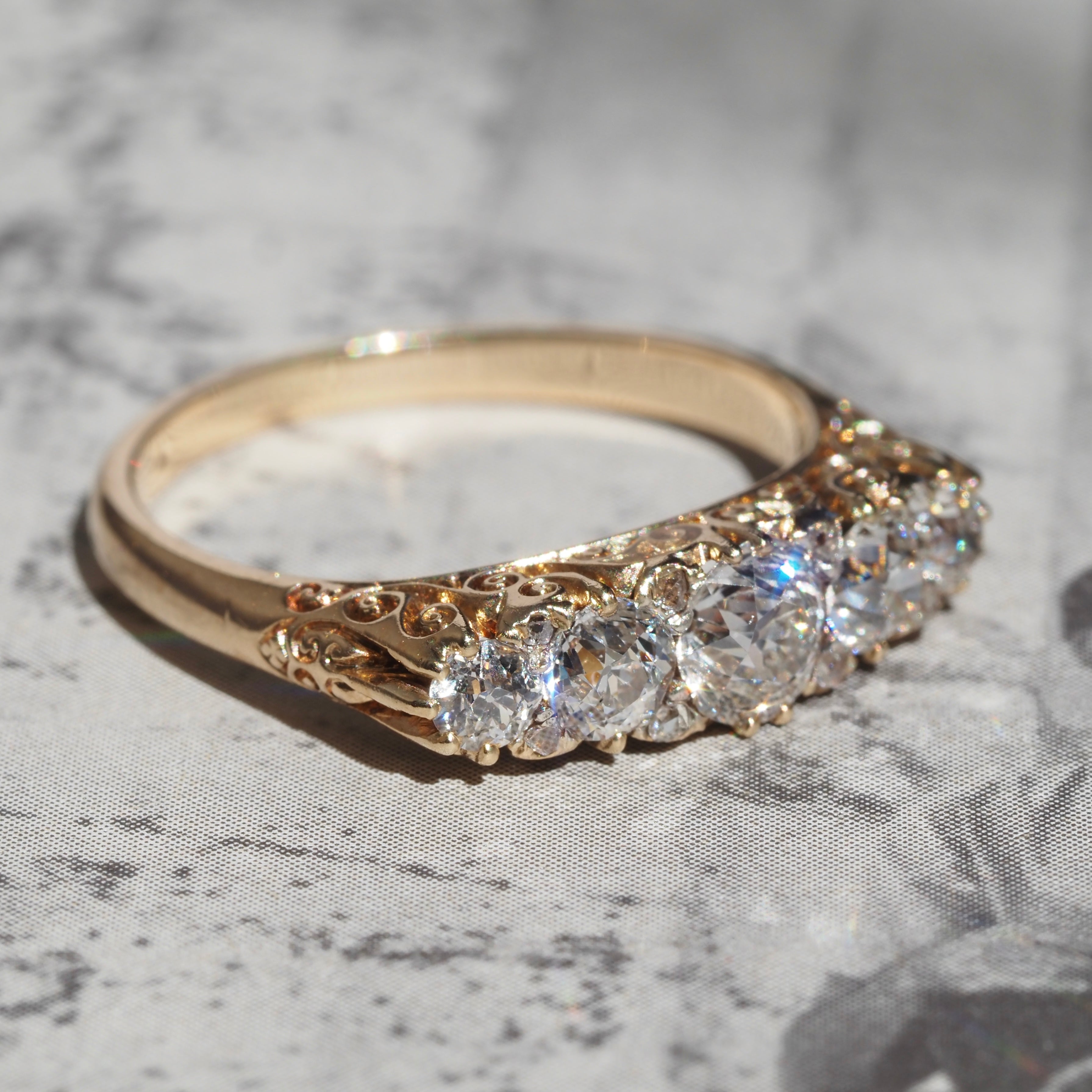 Antique Turn of the Century Old Mine Cut Diamond Five Stone 18k Gold Ring with Rose Cut Diamond Accents