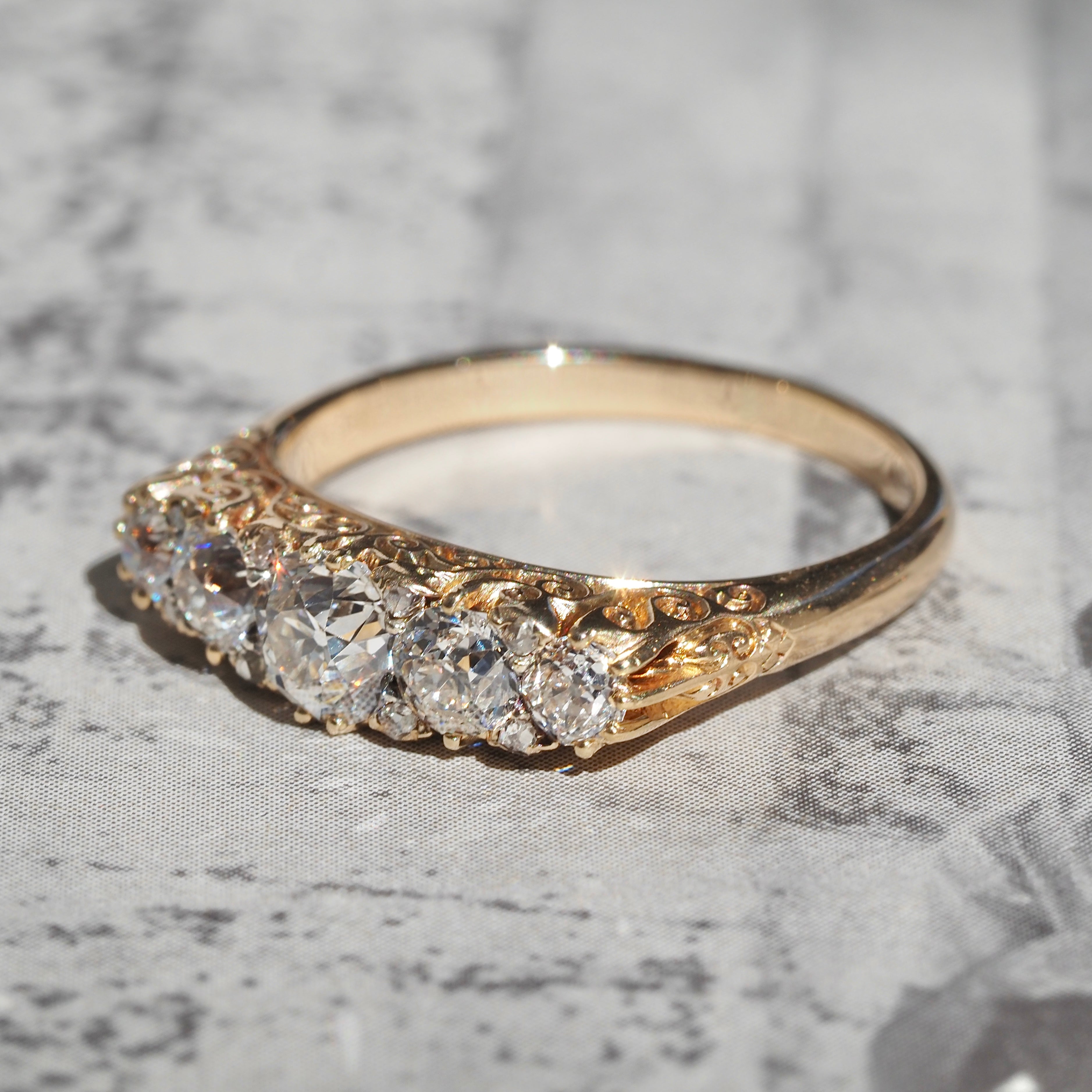 Antique Turn of the Century Old Mine Cut Diamond Five Stone 18k Gold Ring with Rose Cut Diamond Accents