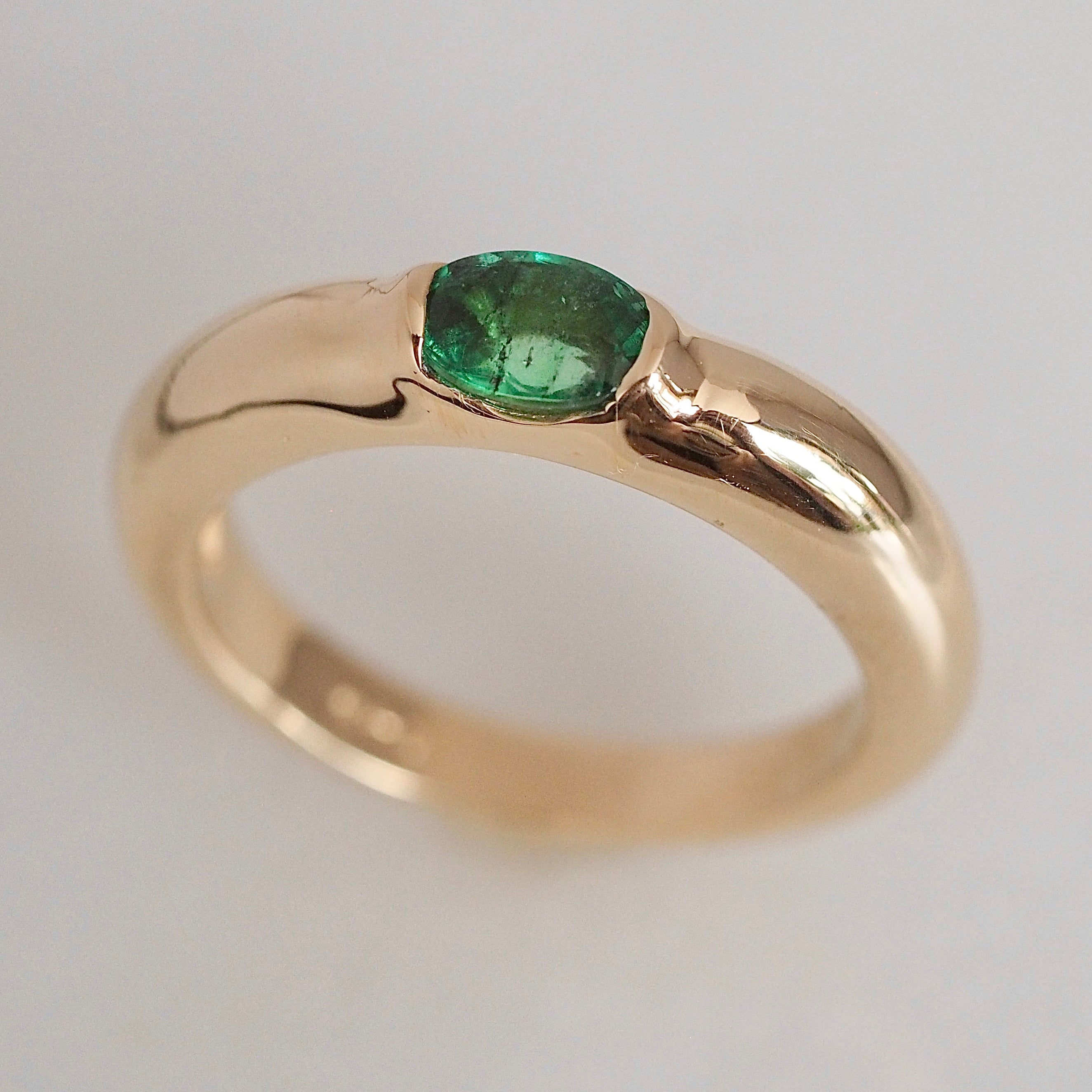 Modernist 14k Gold Emerald Half Bezel Ring