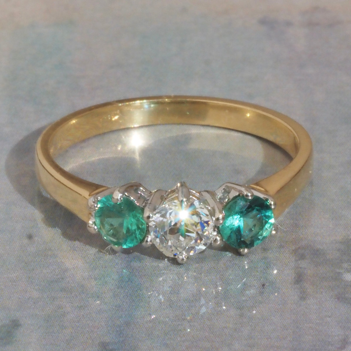 Vintage English Natural Emerald and Old European Cut Diamond Trilogy 18k Gold Ring