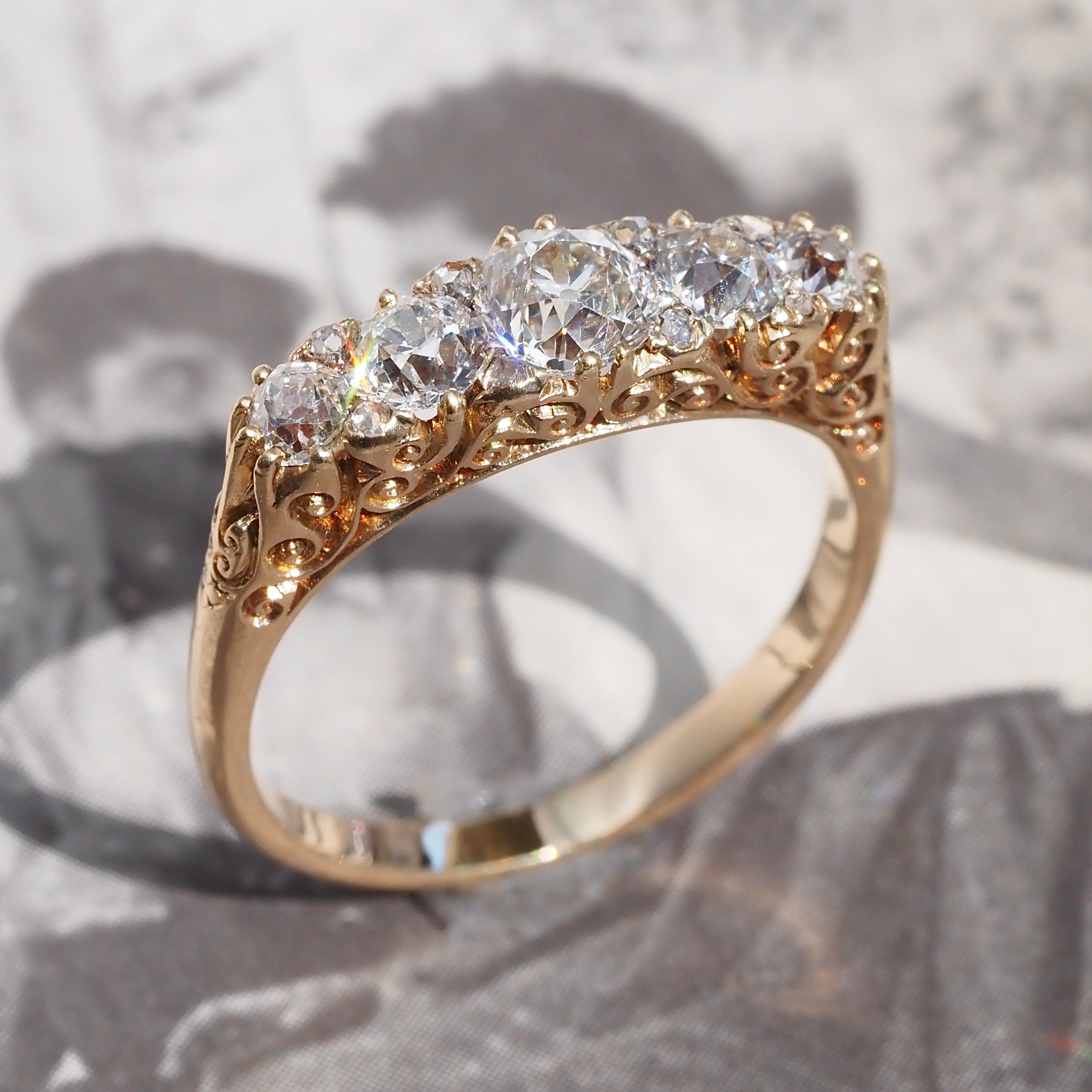 Antique Turn of the Century Old Mine Cut Diamond Five Stone 18k Gold Ring with Rose Cut Diamond Accents