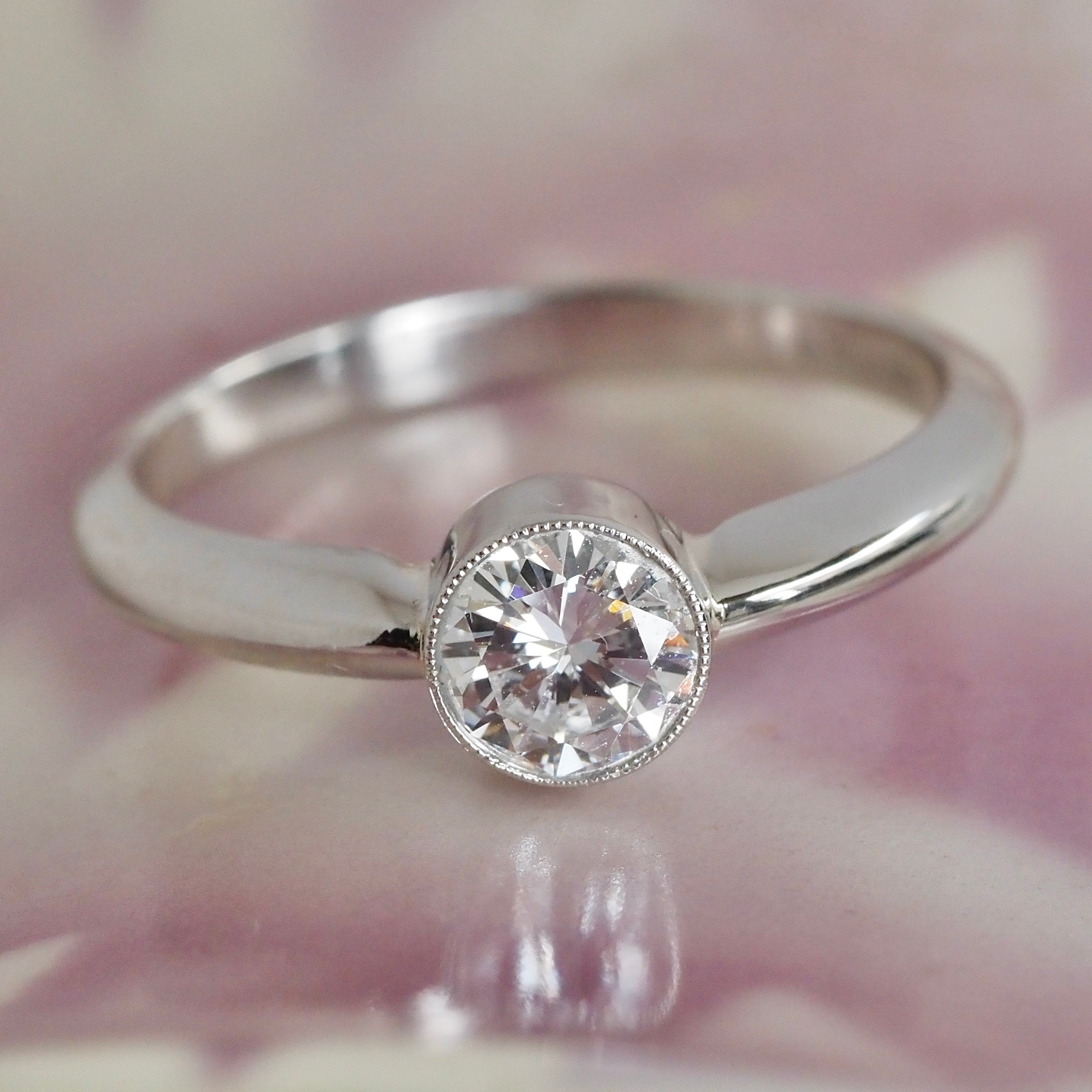Half Carat Round Brilliant Cut Diamond Solitaire Platinum Bezel Set Engagement Ring