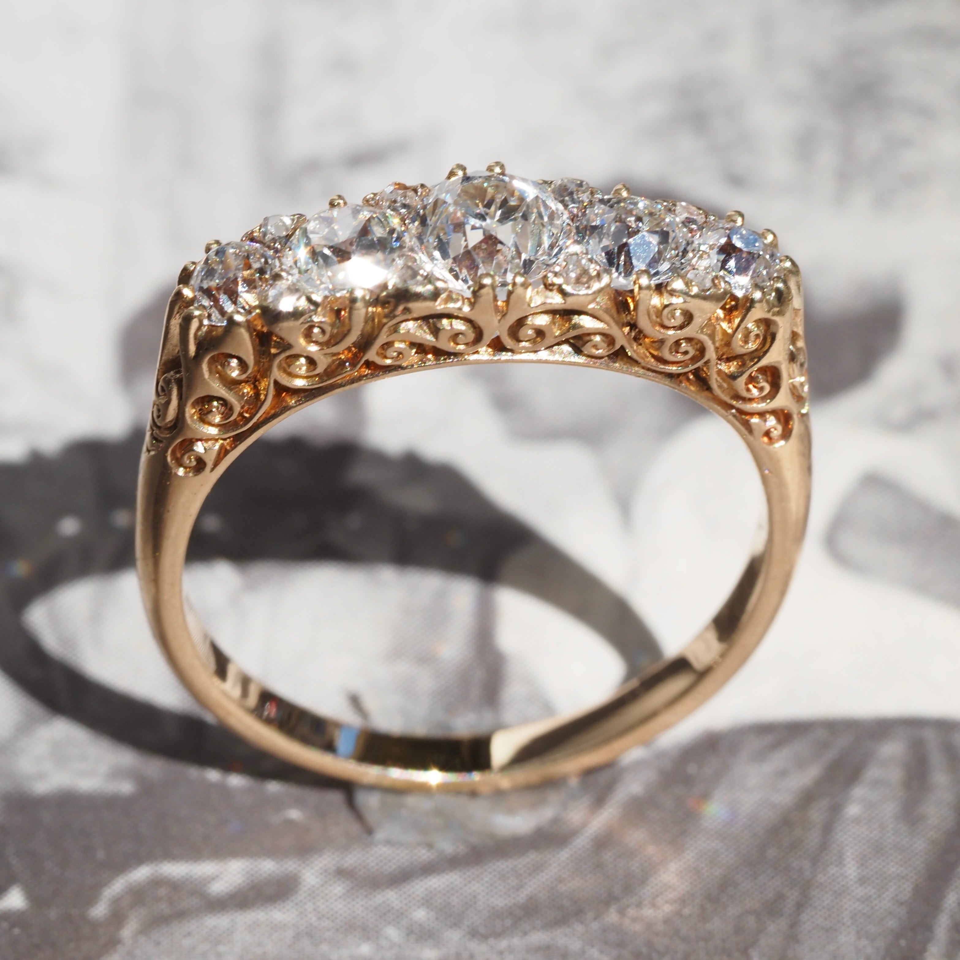 Antique Turn of the Century Old Mine Cut Diamond Five Stone 18k Gold Ring with Rose Cut Diamond Accents